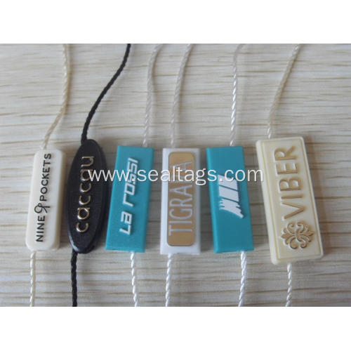 luggage labels with string and plastic bead